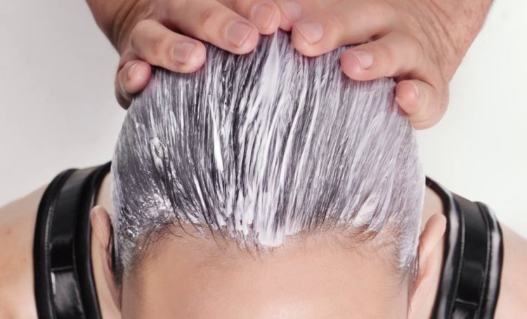 Woman with long, strong, smooth hair after completing an at-home keratin treatment, showing reduced frizz, enhanced shine, and healthier lengths.