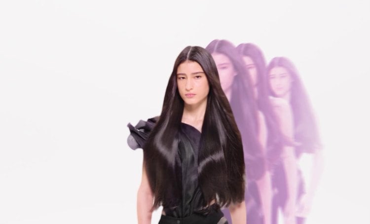 Woman with long, smooth, straight hair after using a keratin treatment, showing reduced frizz, enhanced shine, and visibly healthier hair texture.