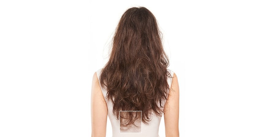 Before and after focusing on split ends of a woman with long brown hair, showing visibly smoother, healthier tips after targeted care.