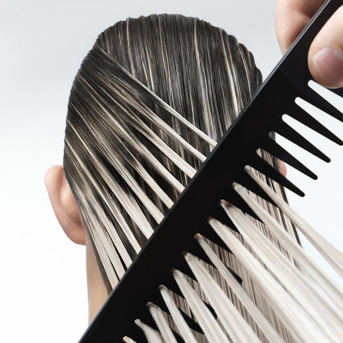Hair mask for every type of hair applied to long brunette ombré locks to demonstrate deep repair and professional shine. 